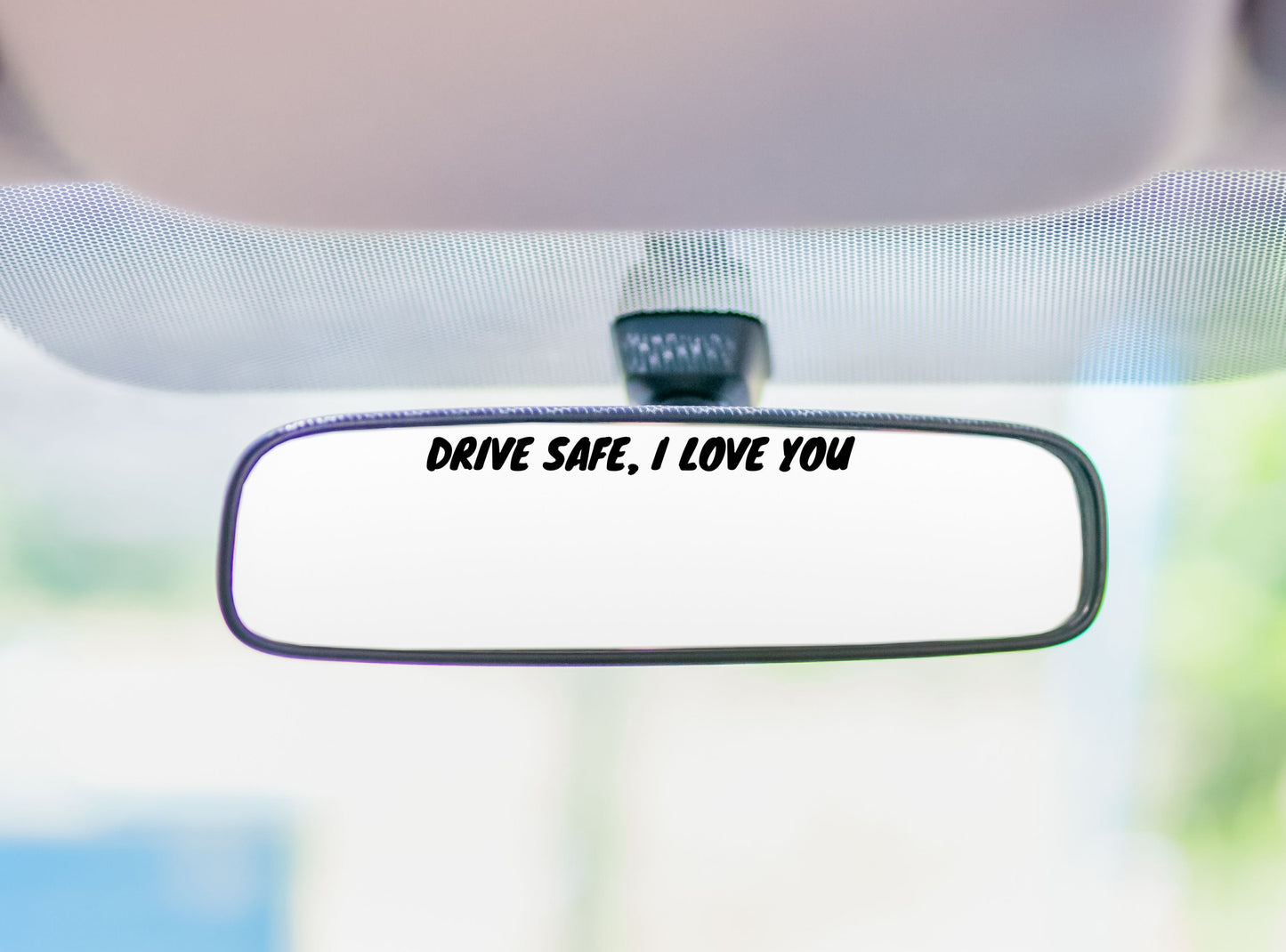 Vinyl Car Decal on a rear view mirror that says Drive safe, I love you
