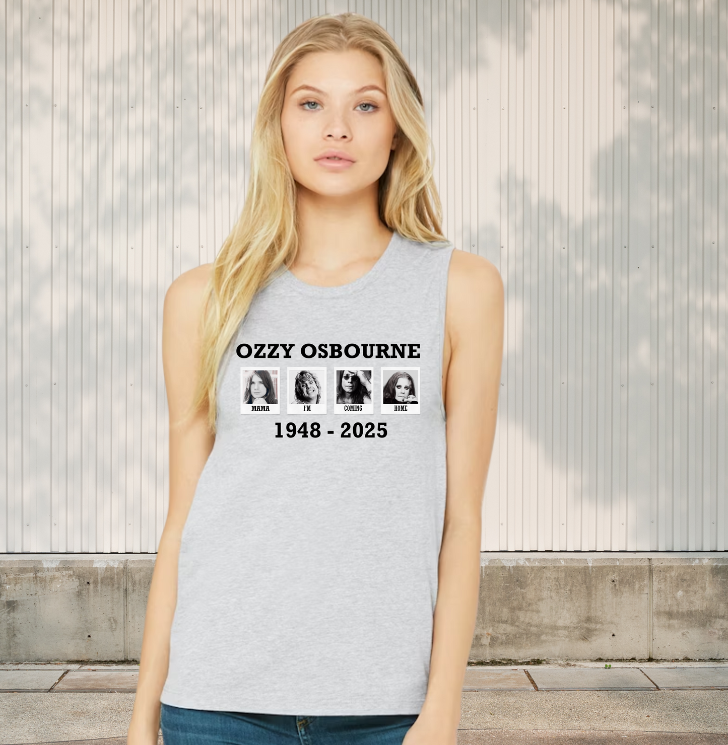 Person wearing a gray tank top with 'Ozzy Osbourne' text and years printed on it, standing outdoors.