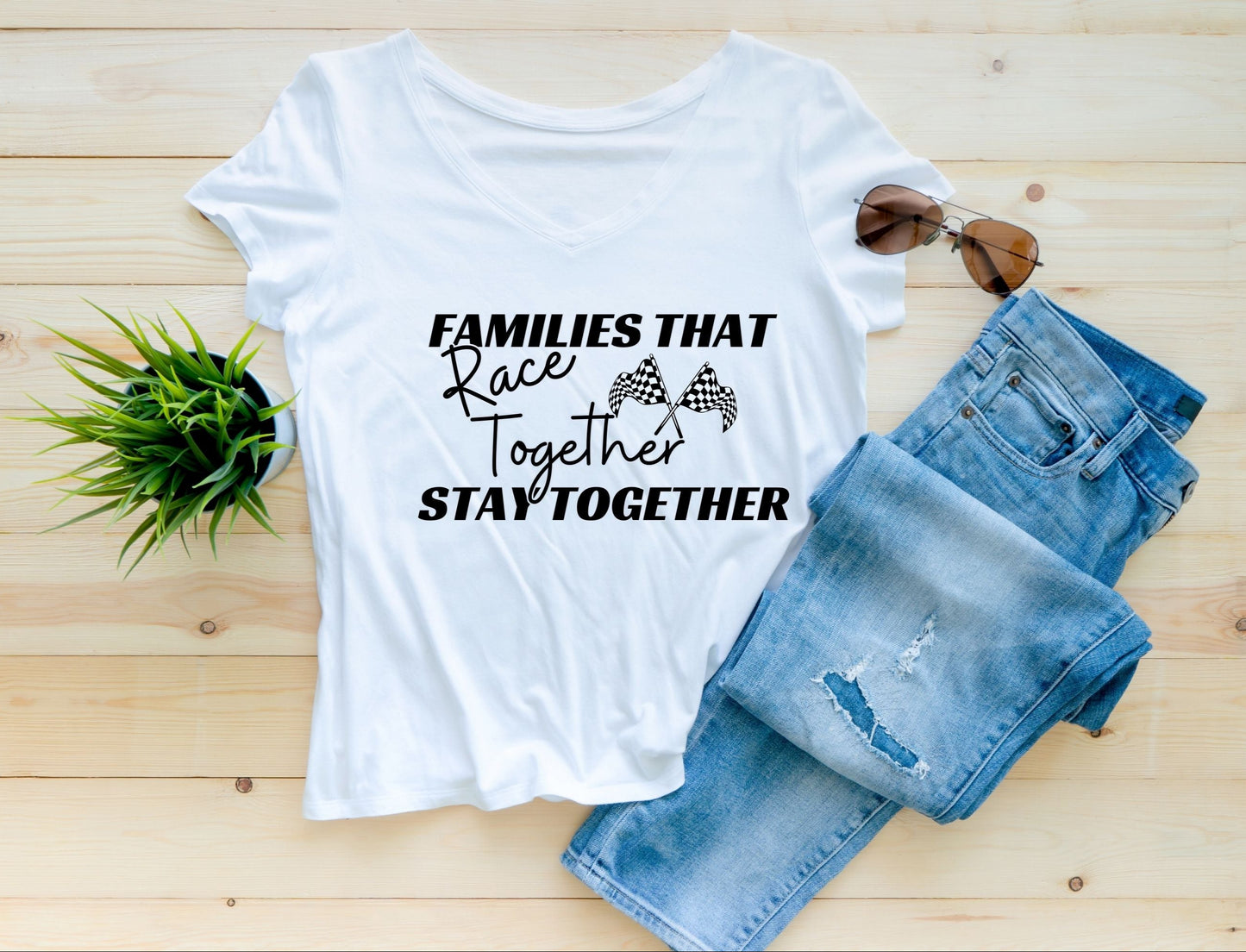 White Tee that says families that race together stay together with racing flags. 