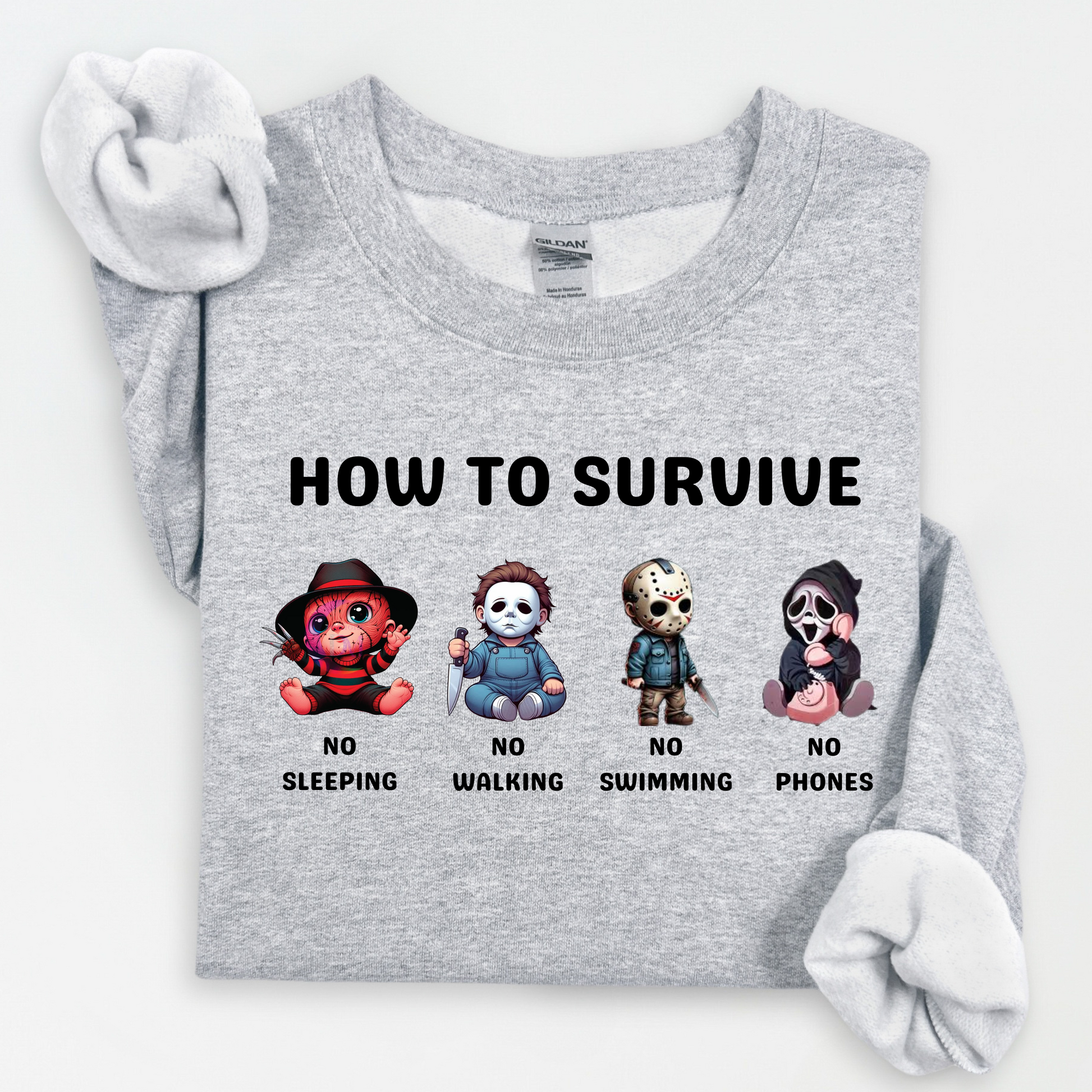 Gray sweatshirt with graphic designs and text 'How to Survive' on a white background