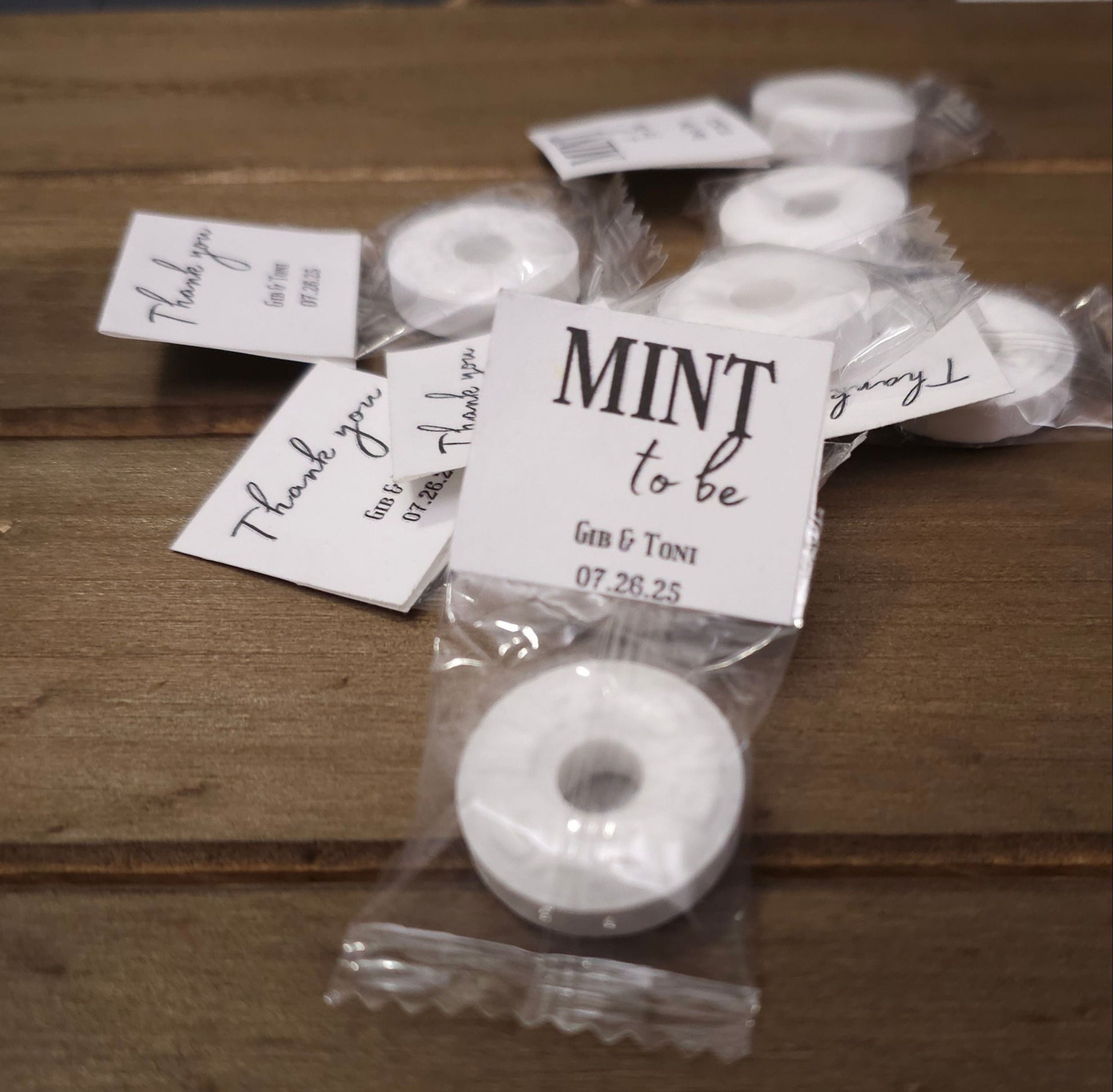 individually wrapped mints that say thank you on one side and mint to be on the other with the couple's names and wedding date on both sides. 