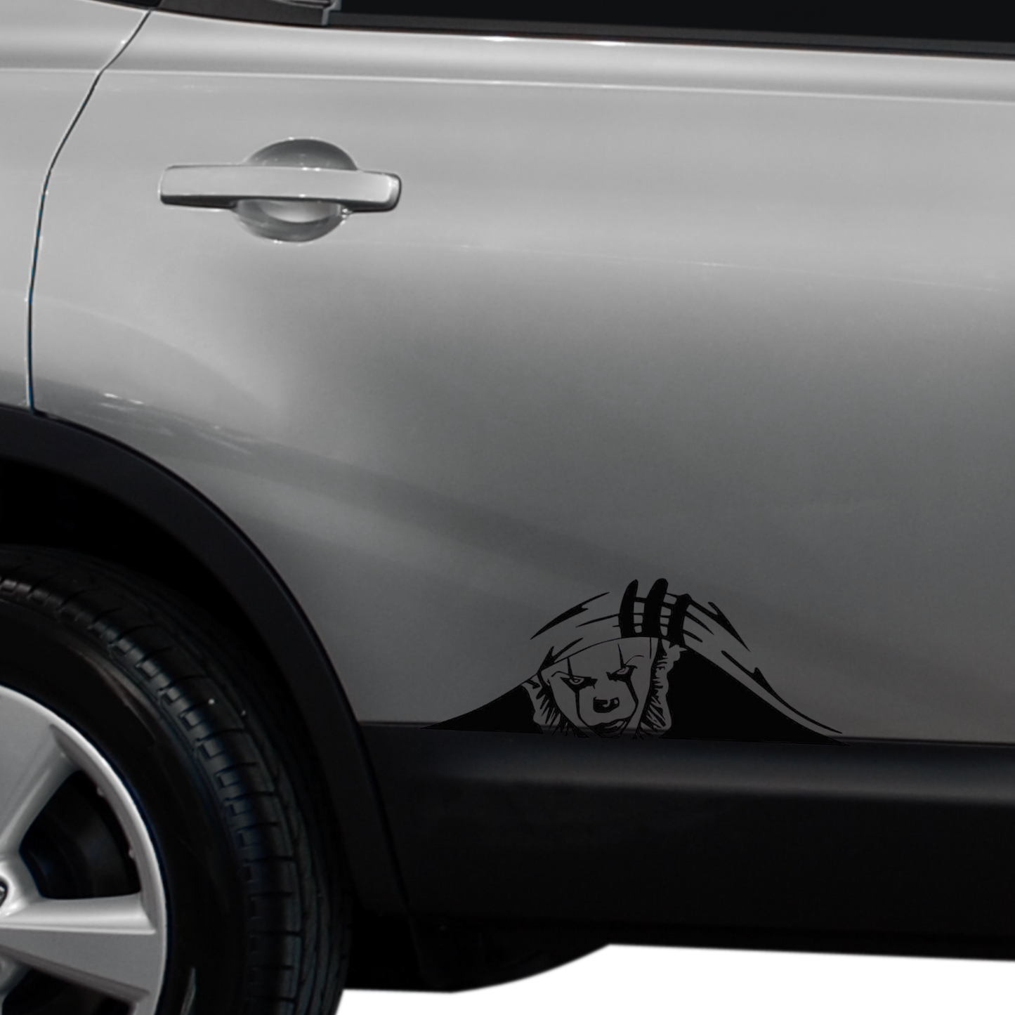 Pennywise on the side of a SUV peeking up from under the paint. High-quality matte black finish