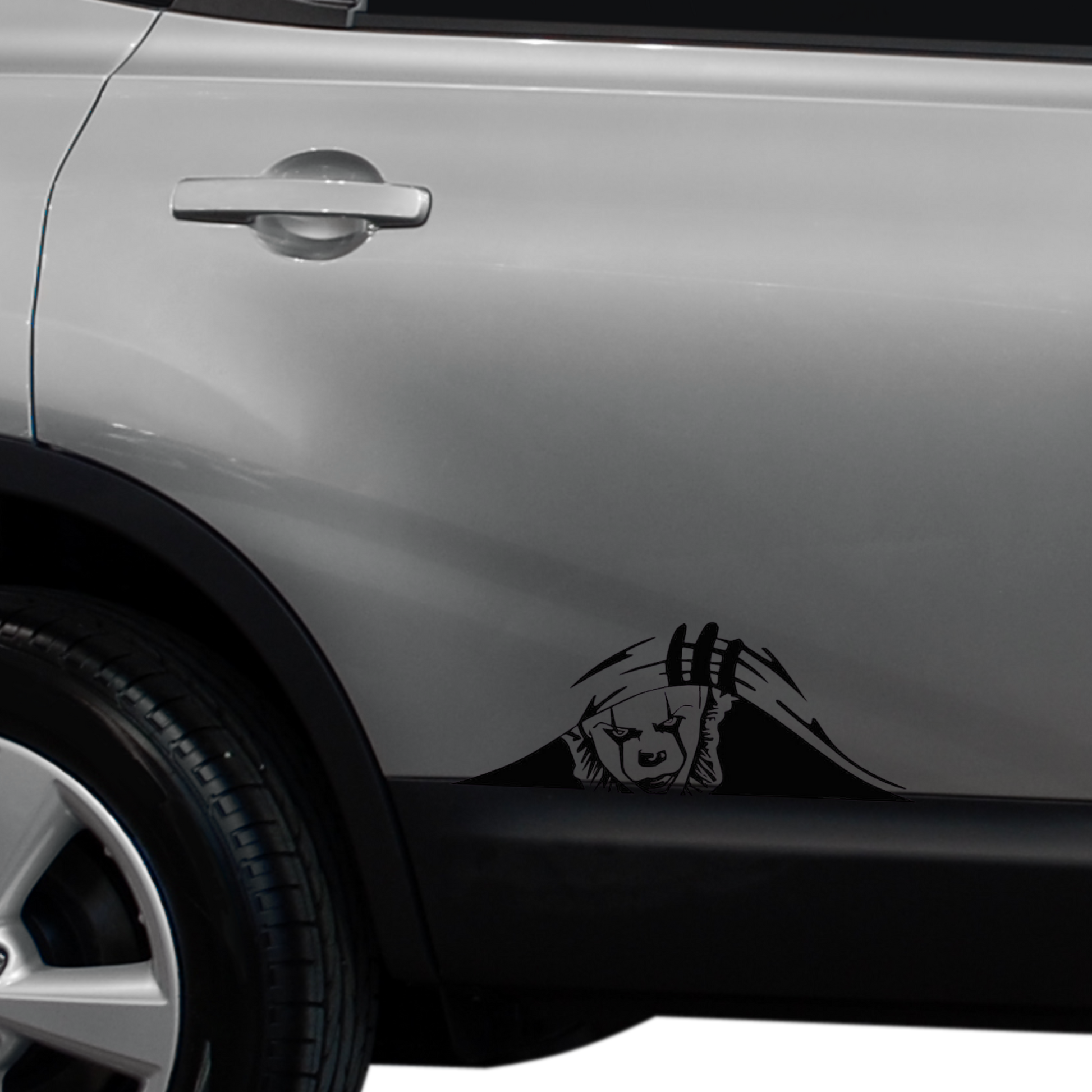 Pennywise on the side of a SUV peeking up from under the paint. High-quality matte black finish