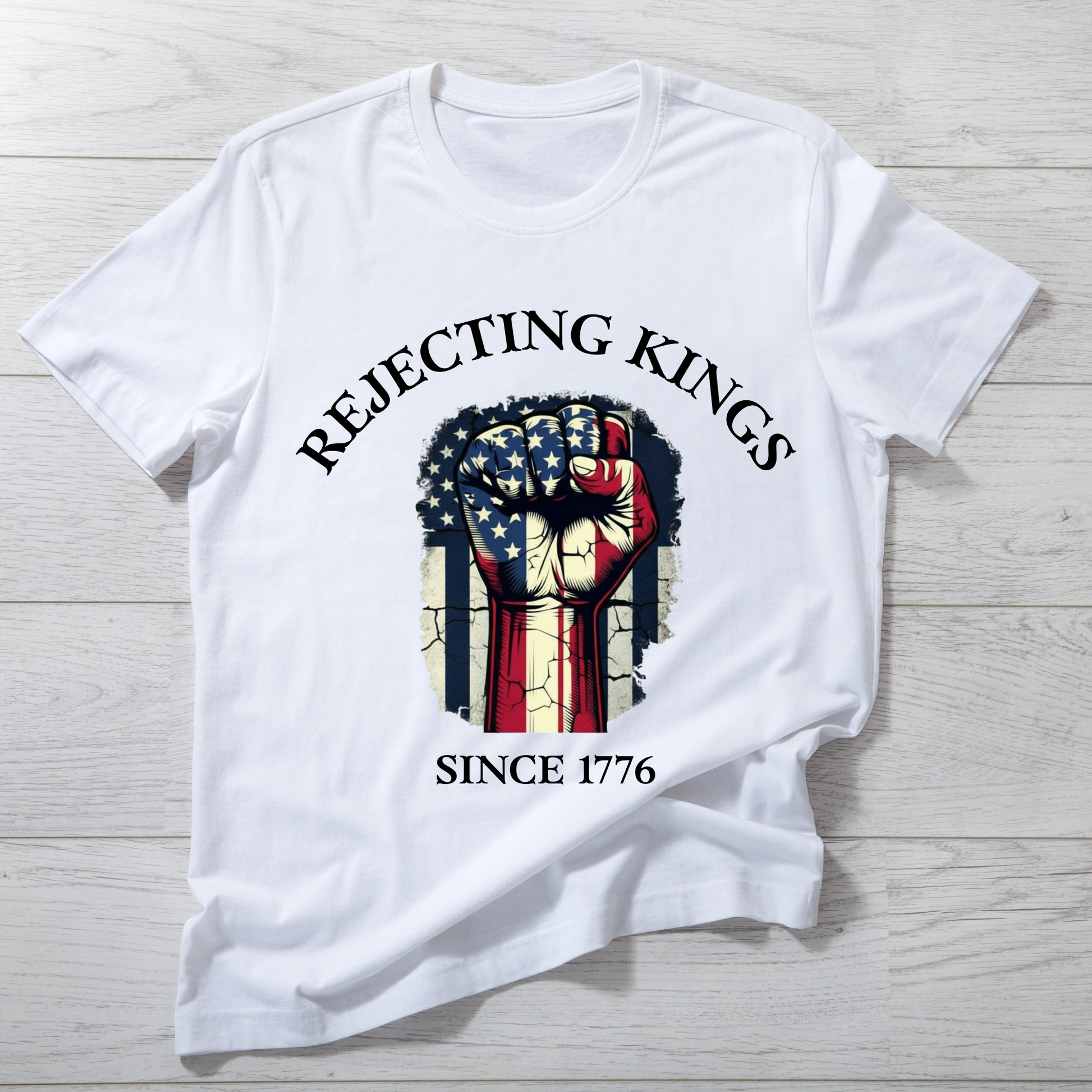 White t-shirt with graphic design and text on a wooden surface