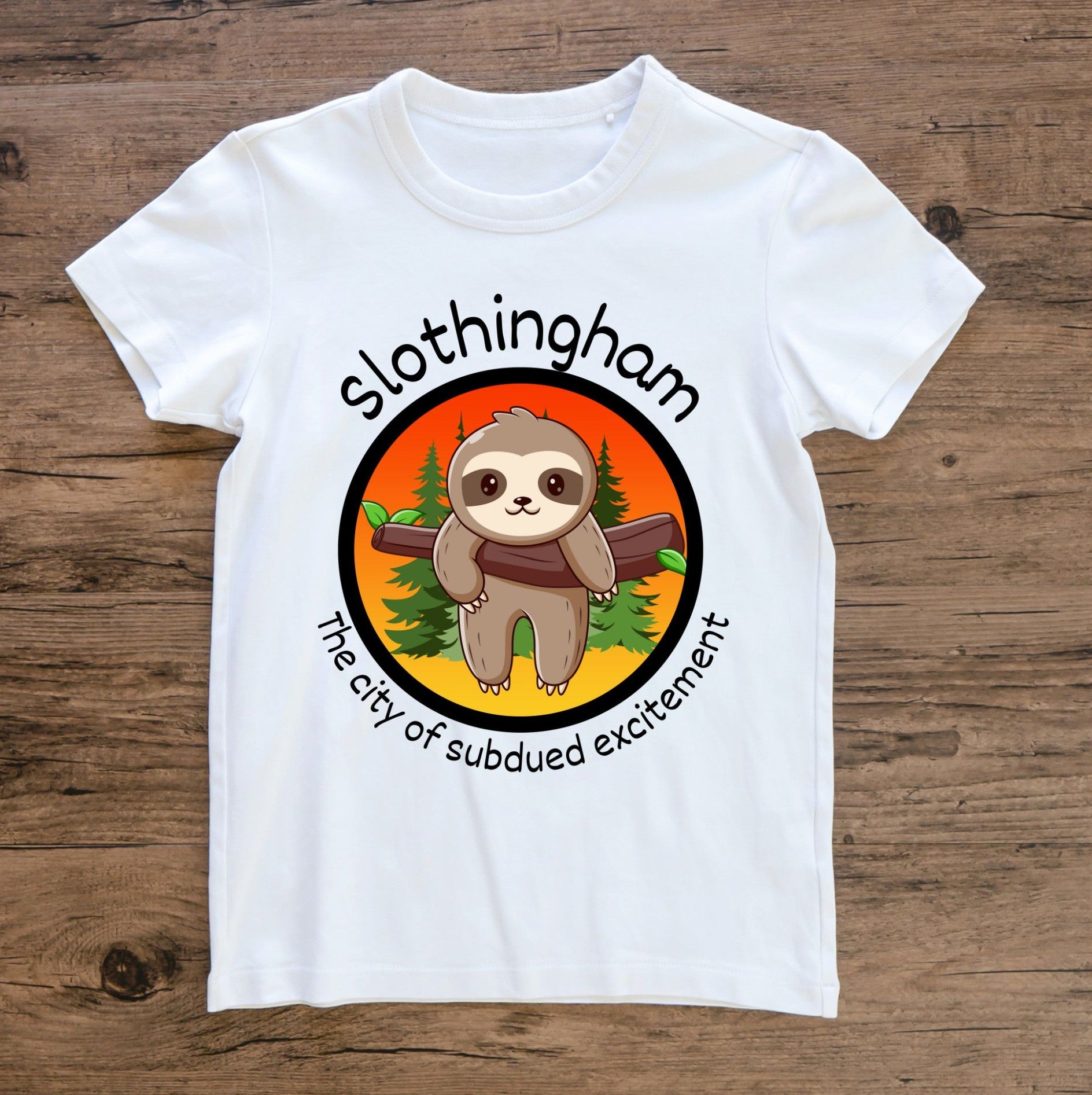 White Tshirt with the image of a sloth hanging in a tree and the saying "Slothingham, the City of Subdued Excitement". 