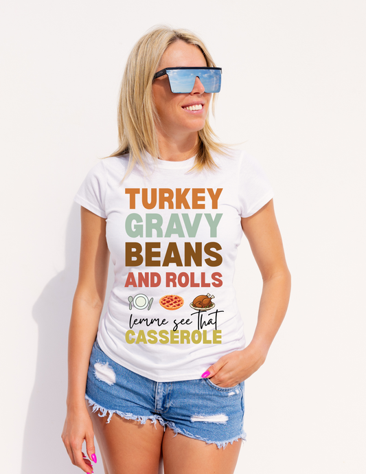 Woman wearing a white t-shirt with humorous text design on a plain background