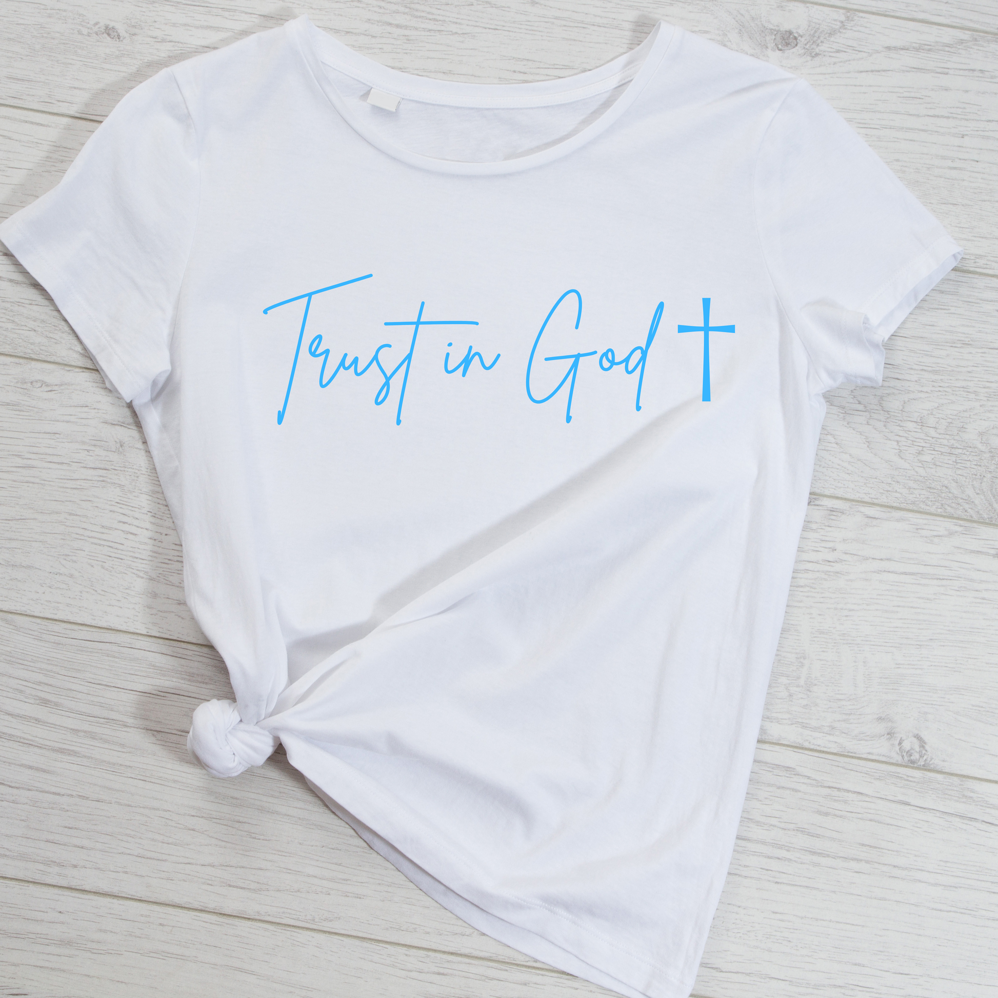 White Shirt tied with a knot at the bottom that says Trust in God